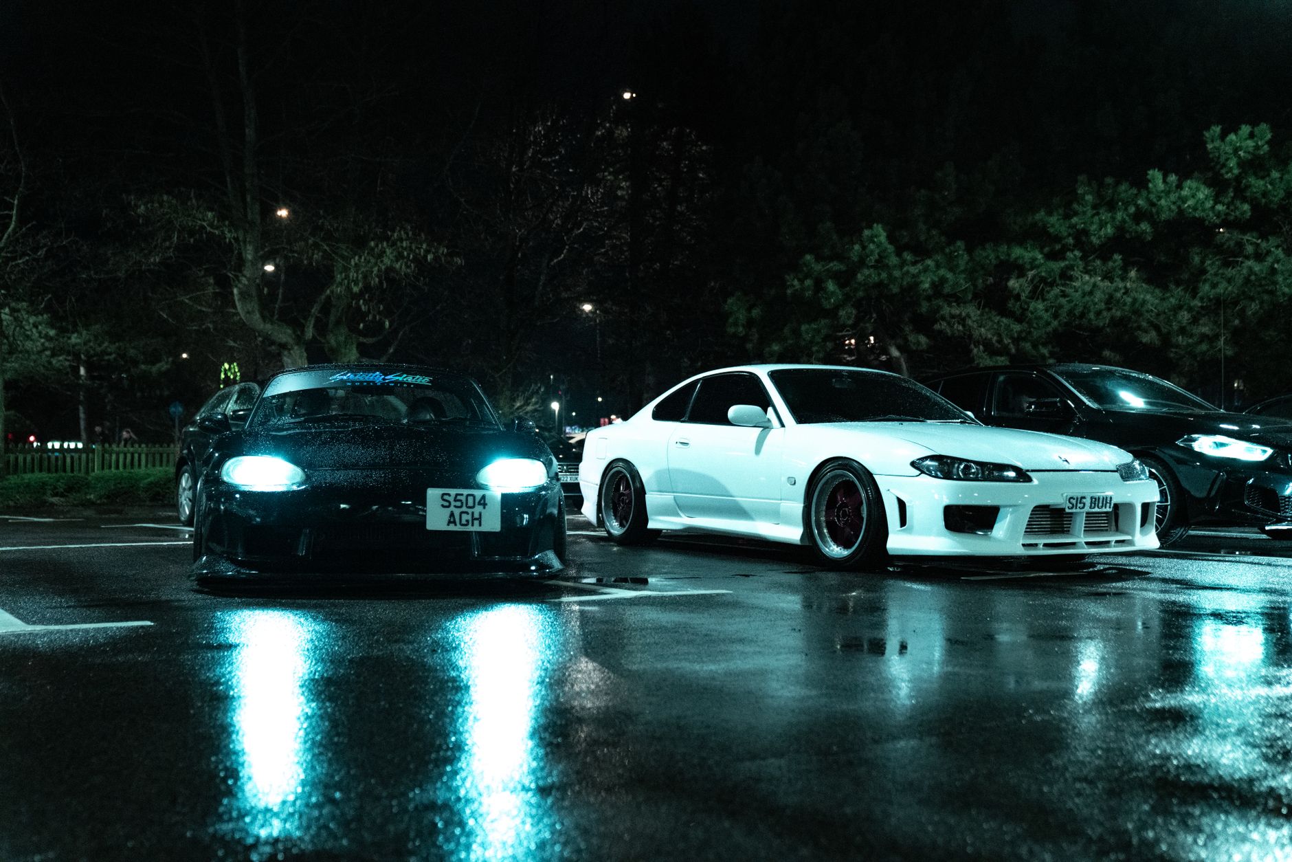 UK car club community online organising 2026 night meet in city car park with modified cars