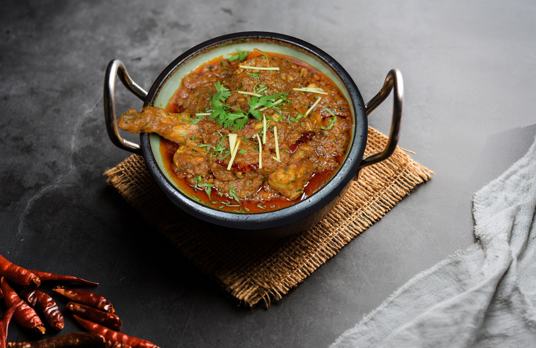Close-up of a balti and mixed grill, a staple at the best curry restaurants in UK car culture