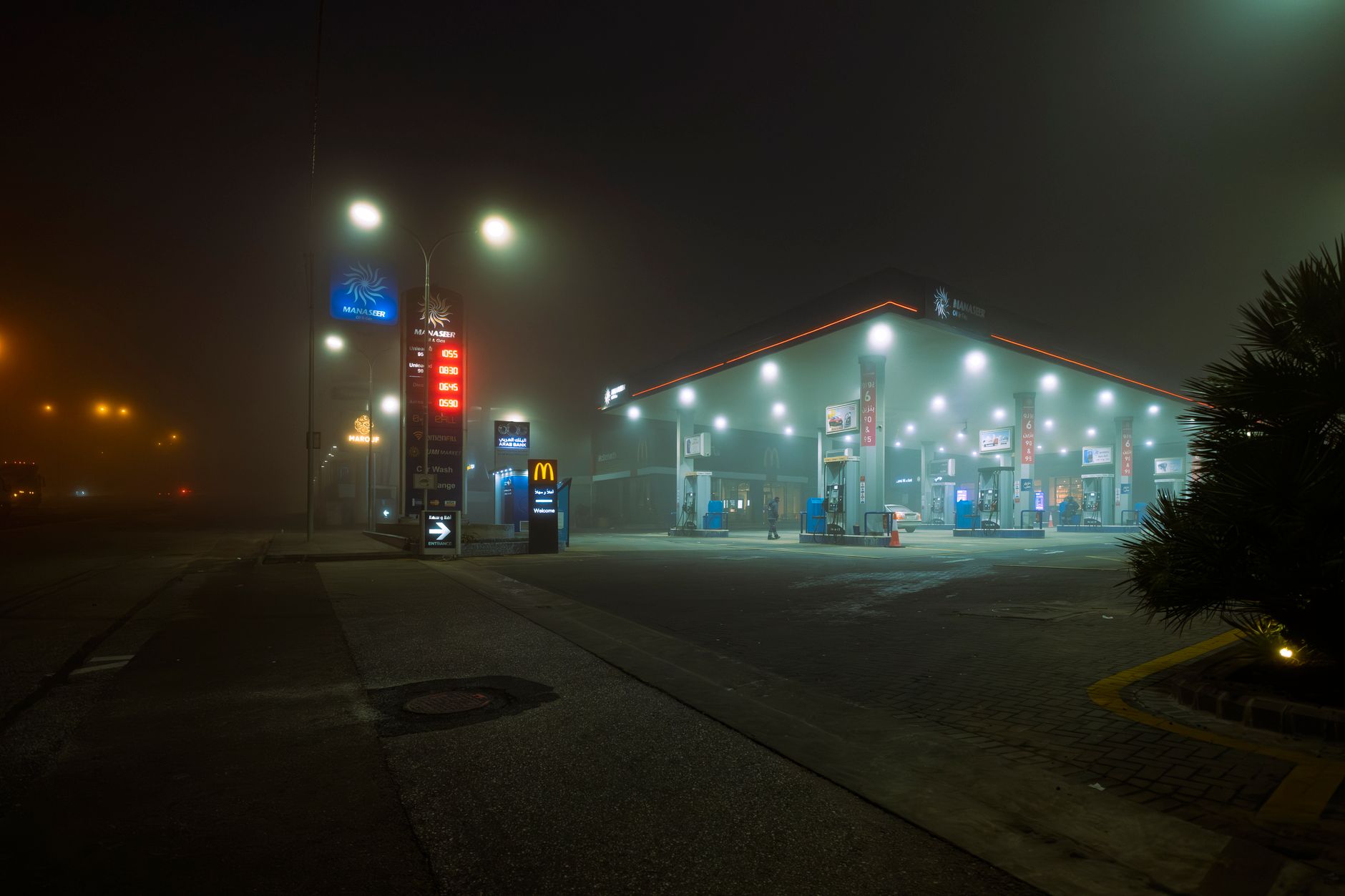 Illustration of a UK motorway service station with cars parked outside, representing the best UK motorway service station food 2026